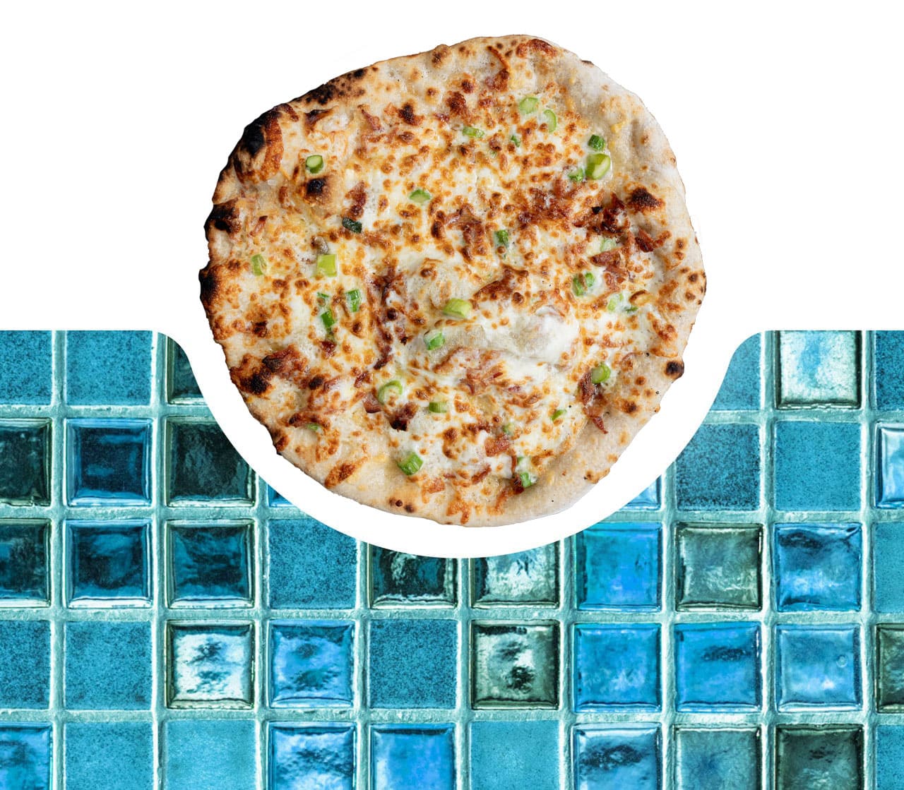 Pizza next to a blue mosaic tile