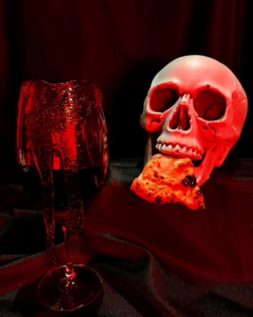 Skull eating pizza